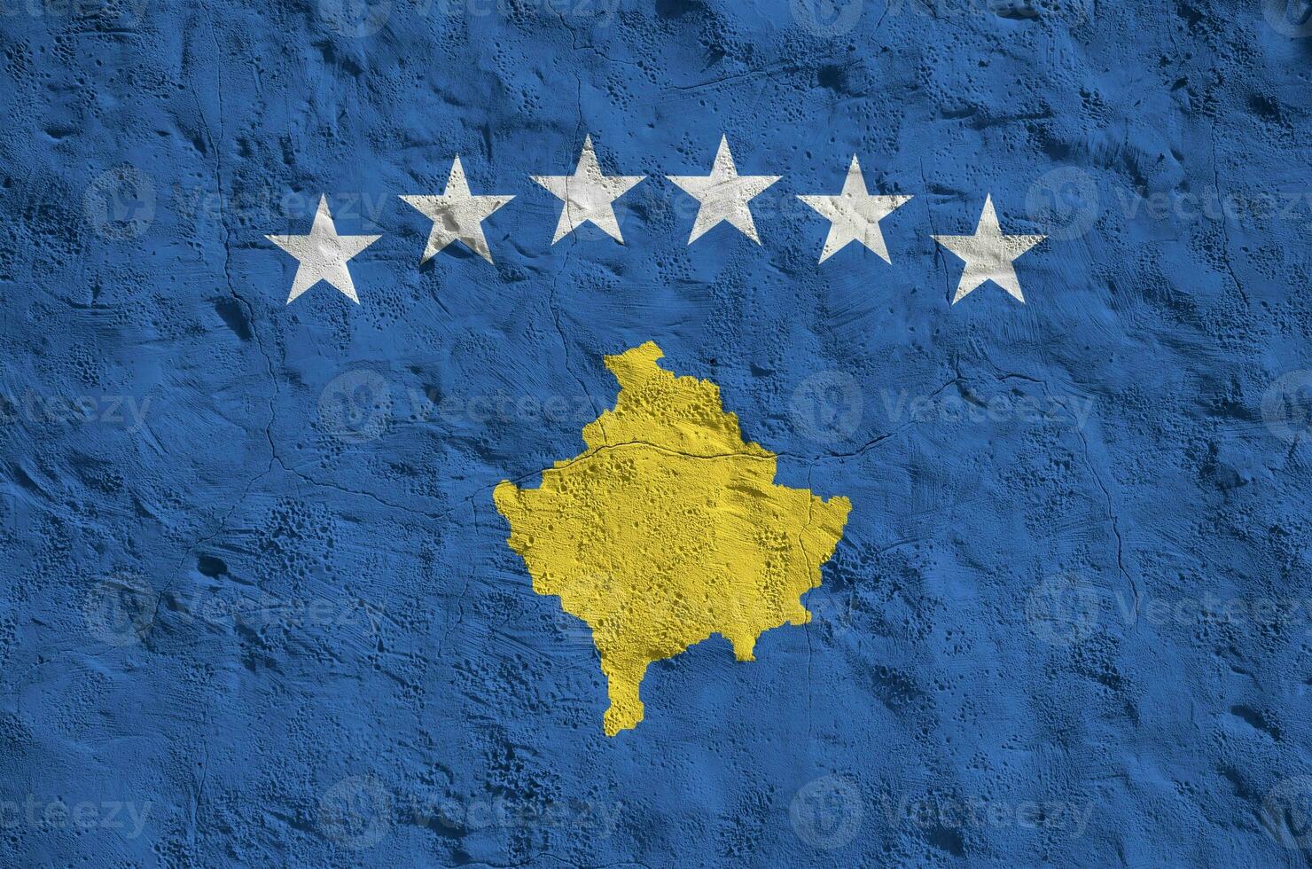 Kosovo flag depicted in bright paint colors on old relief plastering wall. Textured banner on rough background photo