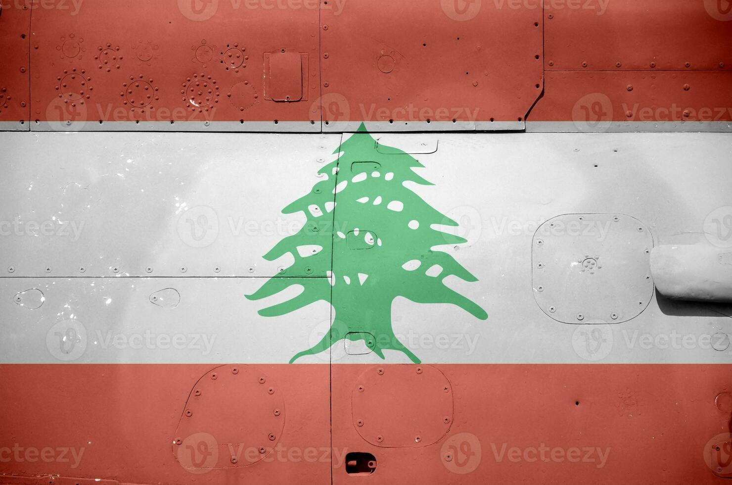 Lebanon flag depicted on side part of military armored helicopter closeup. Army forces aircraft conceptual background photo