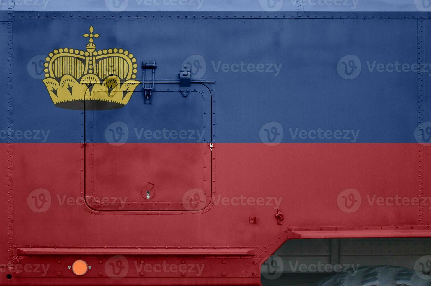 Liechtenstein flag depicted on side part of military armored truck closeup. Army forces conceptual background photo