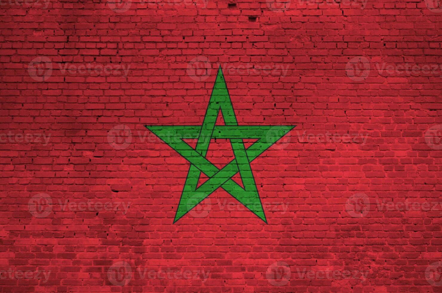 Morocco flag depicted in paint colors on old brick wall. Textured banner on big brick wall masonry background photo