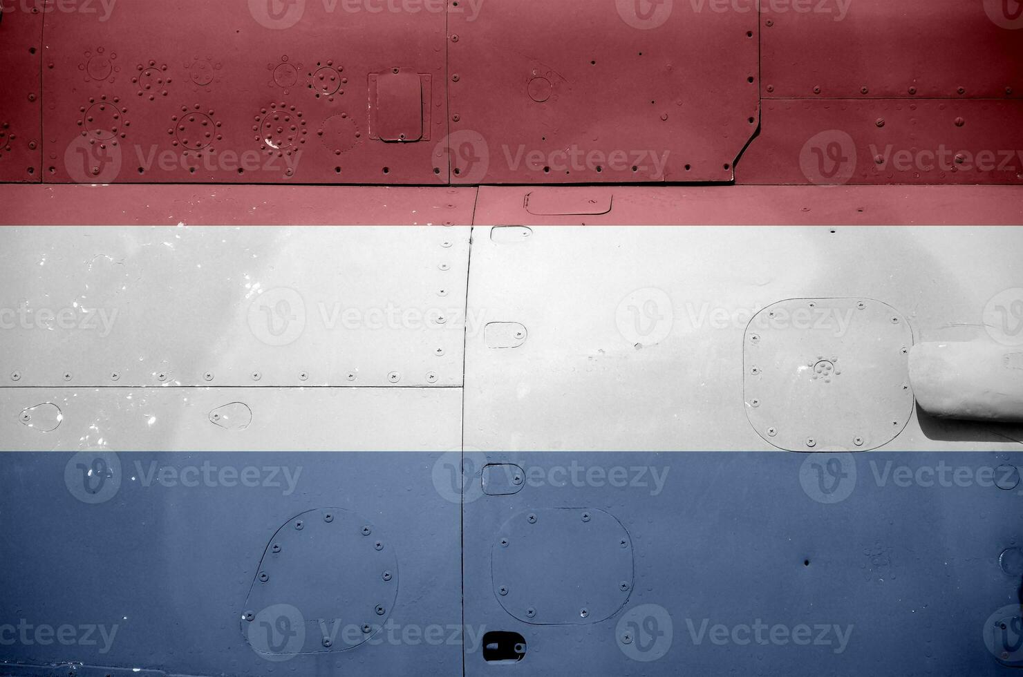 Netherlands flag depicted on side part of military armored helicopter closeup. Army forces aircraft conceptual background photo