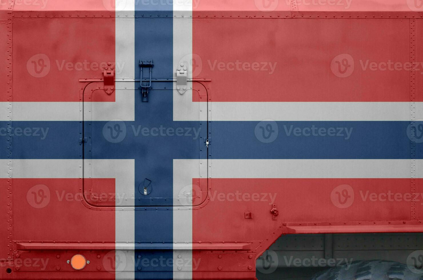 Norway flag depicted on side part of military armored truck closeup. Army forces conceptual background photo
