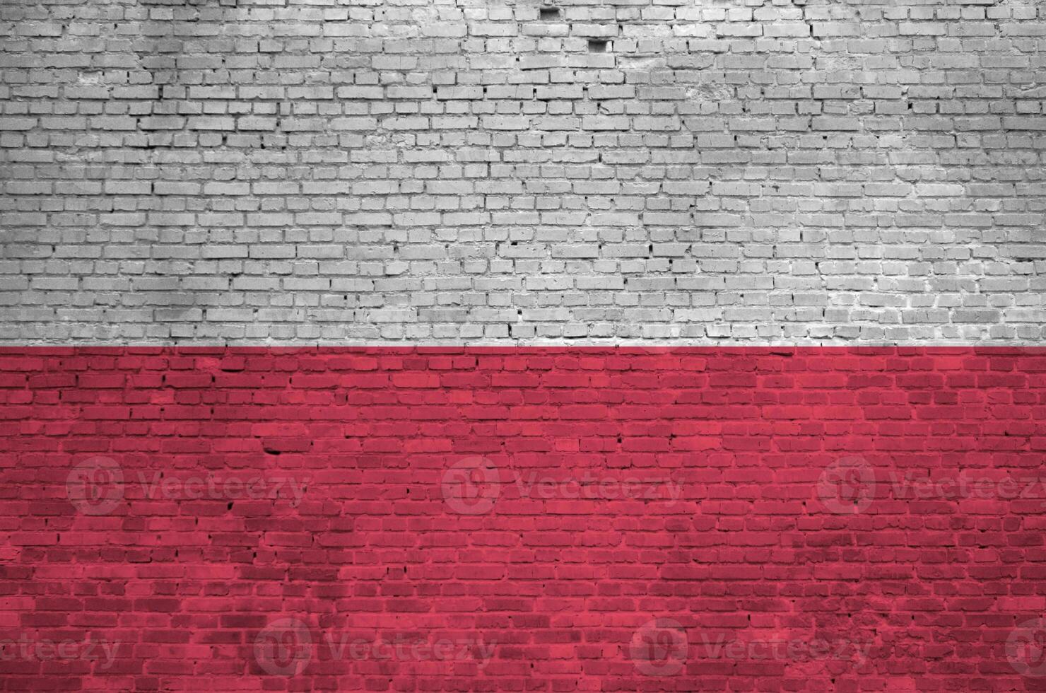 Poland flag depicted in paint colors on old brick wall. Textured banner on big brick wall masonry background photo