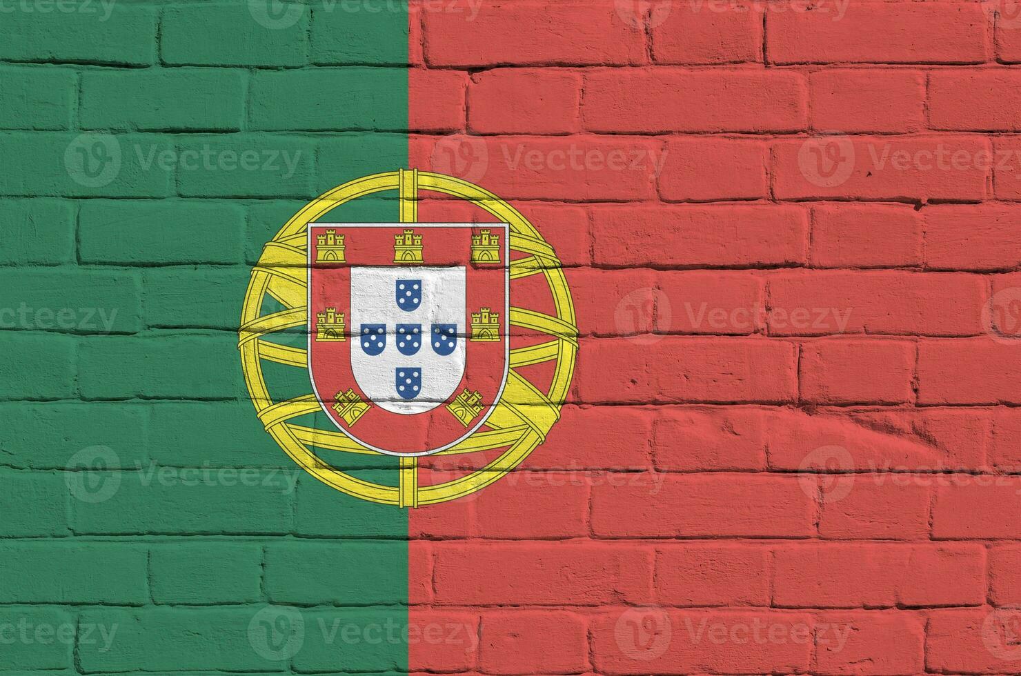 Portugal flag depicted in paint colors on old brick wall. Textured banner on big brick wall masonry background photo