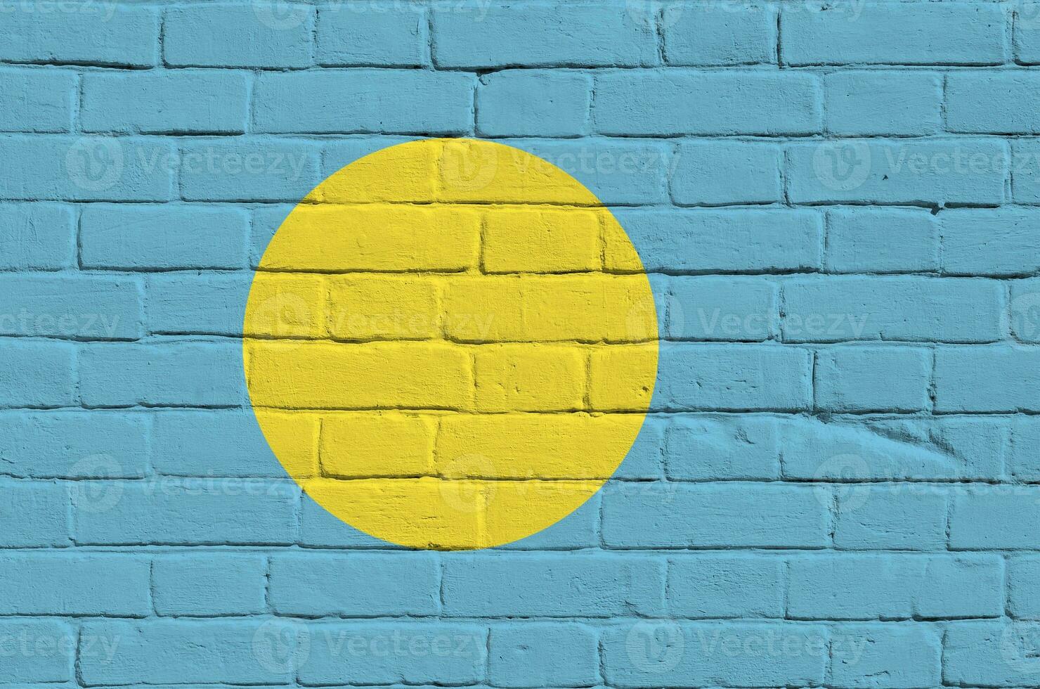 Palau flag depicted in paint colors on old brick wall. Textured banner on big brick wall masonry background photo