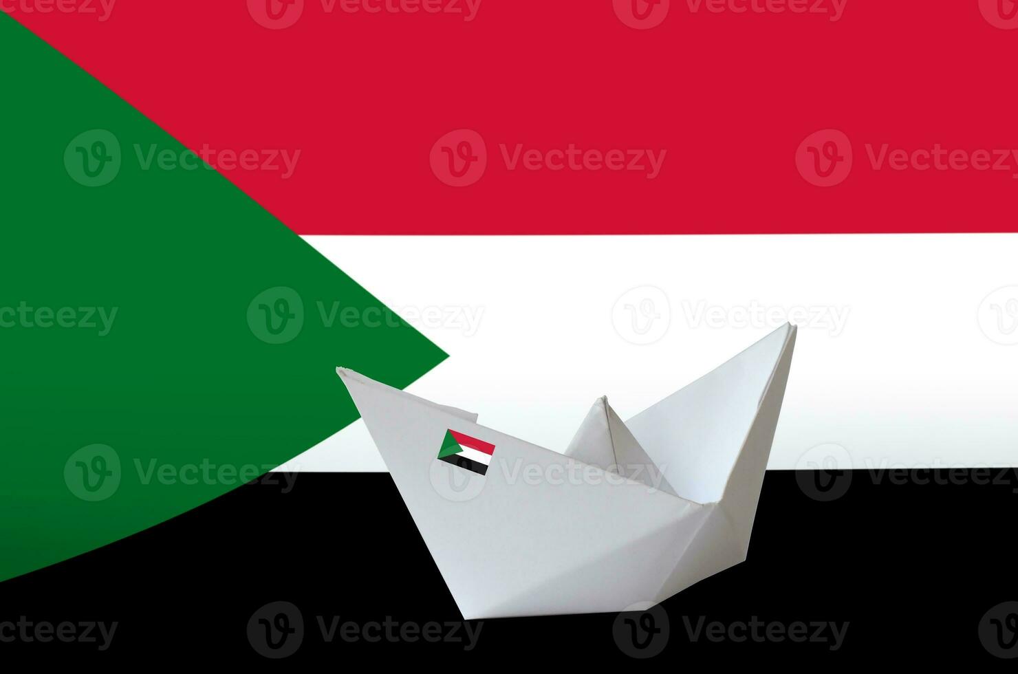 Sudan flag depicted on paper origami ship closeup. Handmade arts concept photo