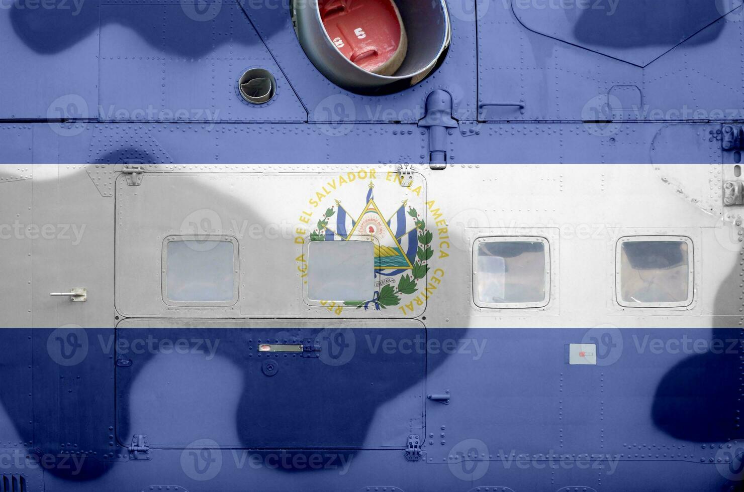 El Salvador flag depicted on side part of military armored helicopter closeup. Army forces aircraft conceptual background photo