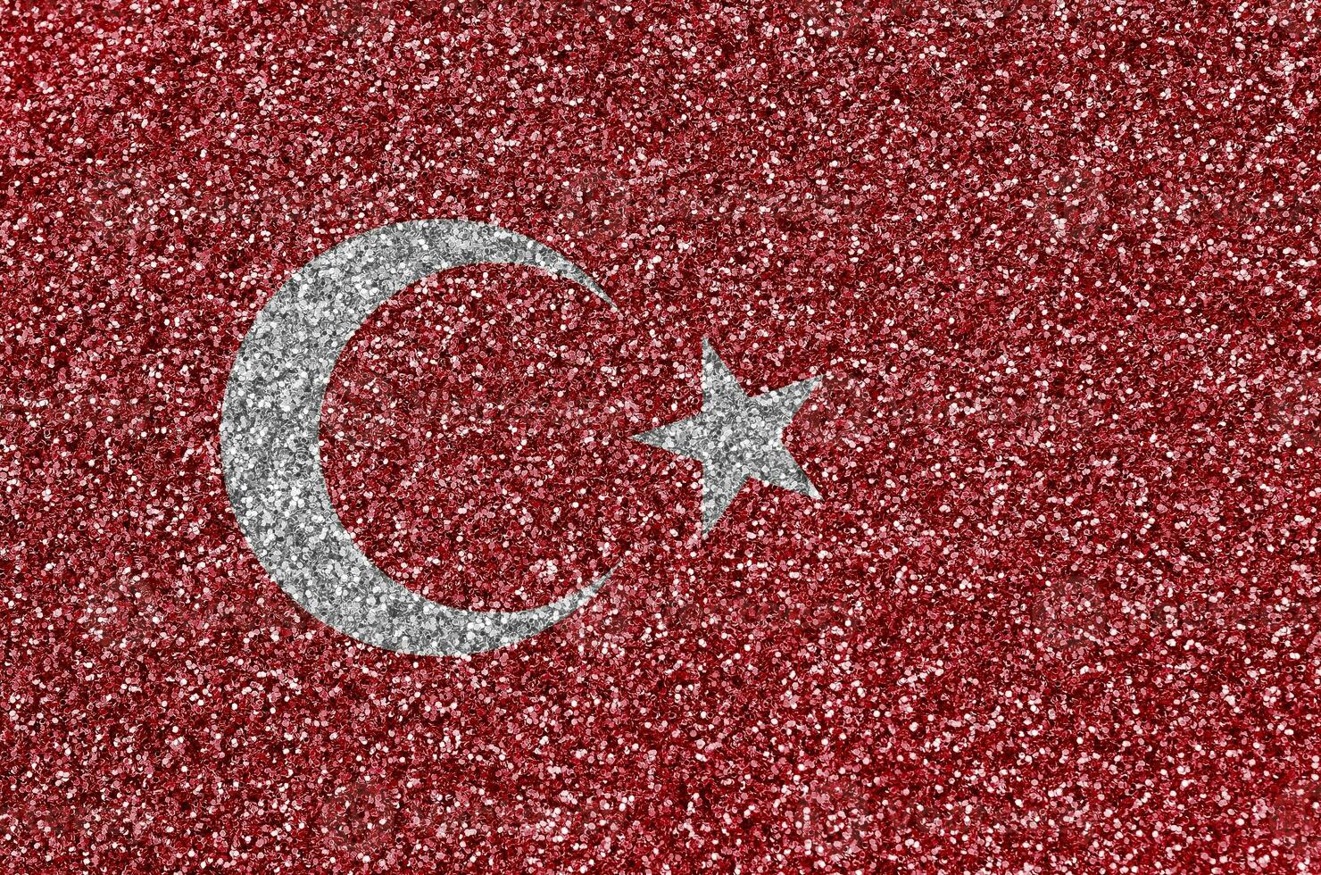 Turkey flag depicted on many small shiny sequins. Colorful festival background for party photo