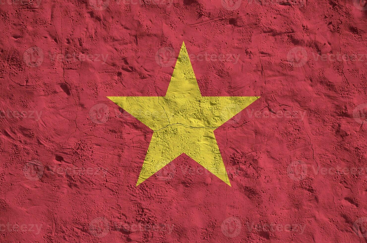 Vietnam flag depicted in bright paint colors on old relief plastering wall. Textured banner on rough background photo