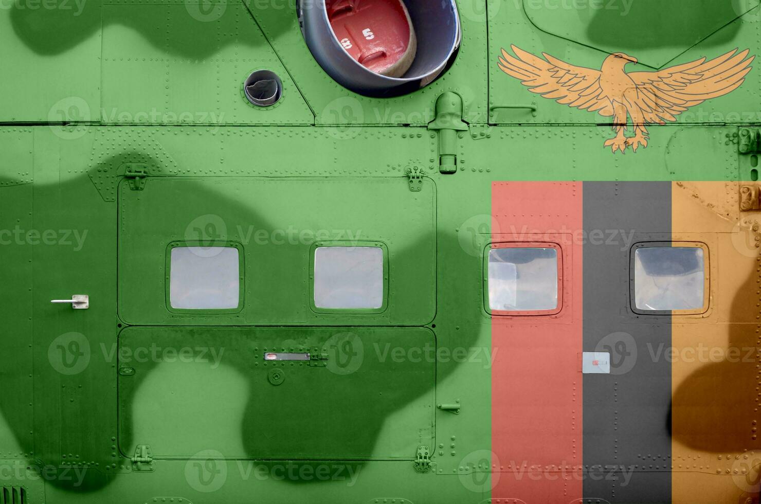 Zambia flag depicted on side part of military armored helicopter closeup. Army forces aircraft conceptual background photo