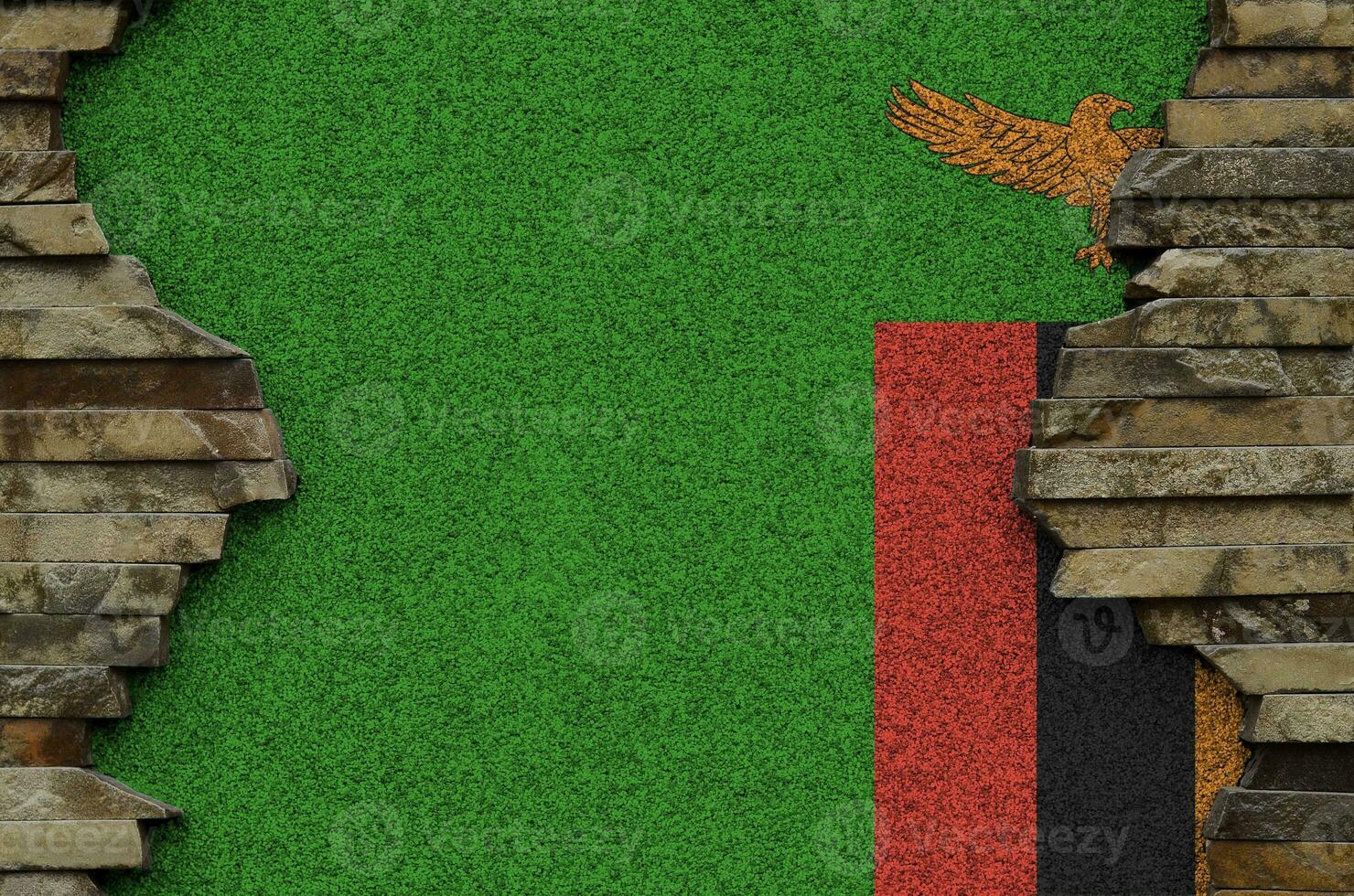 Zambia flag depicted in paint colors on old stone wall closeup. Textured banner on rock wall background photo