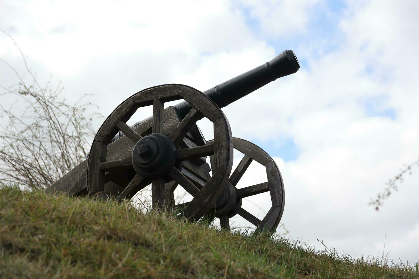 RIVNE, UKRAINE - SEPTEMBER 16, 2023 Ancient castle in Eastern Europe in the Ukrainian city of Dubno. Old cannon on the ramparts of the castle photo
