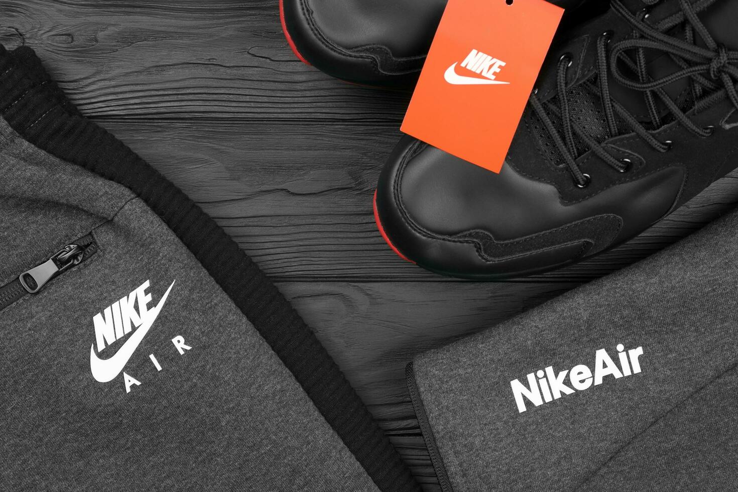 KHARKOV, UKRAINE - DECEMBER 20, 2020 Nike brand clothes and shoes sport wear kit. Nike is American multinational corporation engaged in manufacturing and worldwide marketing of clothes and footwear photo