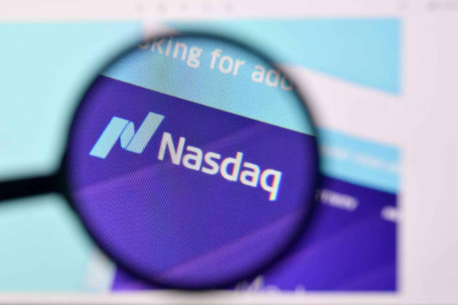 Homepage of nasdaq website on the display of PC, url - business.nasdaq.com. photo