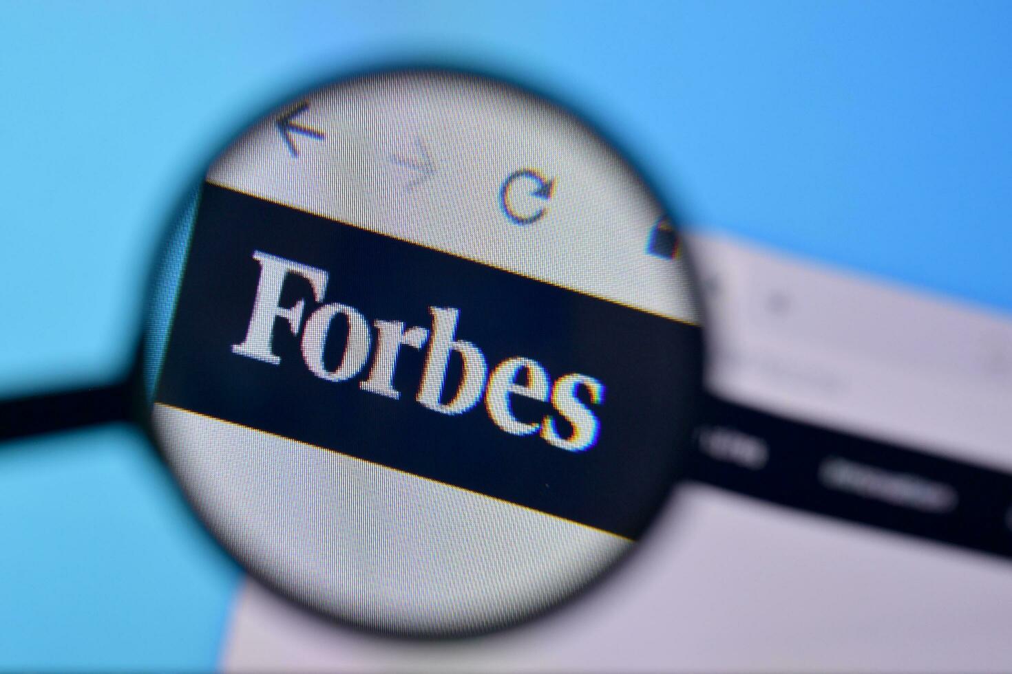 Homepage of forbes website on the display of PC, url - forbes.com. photo