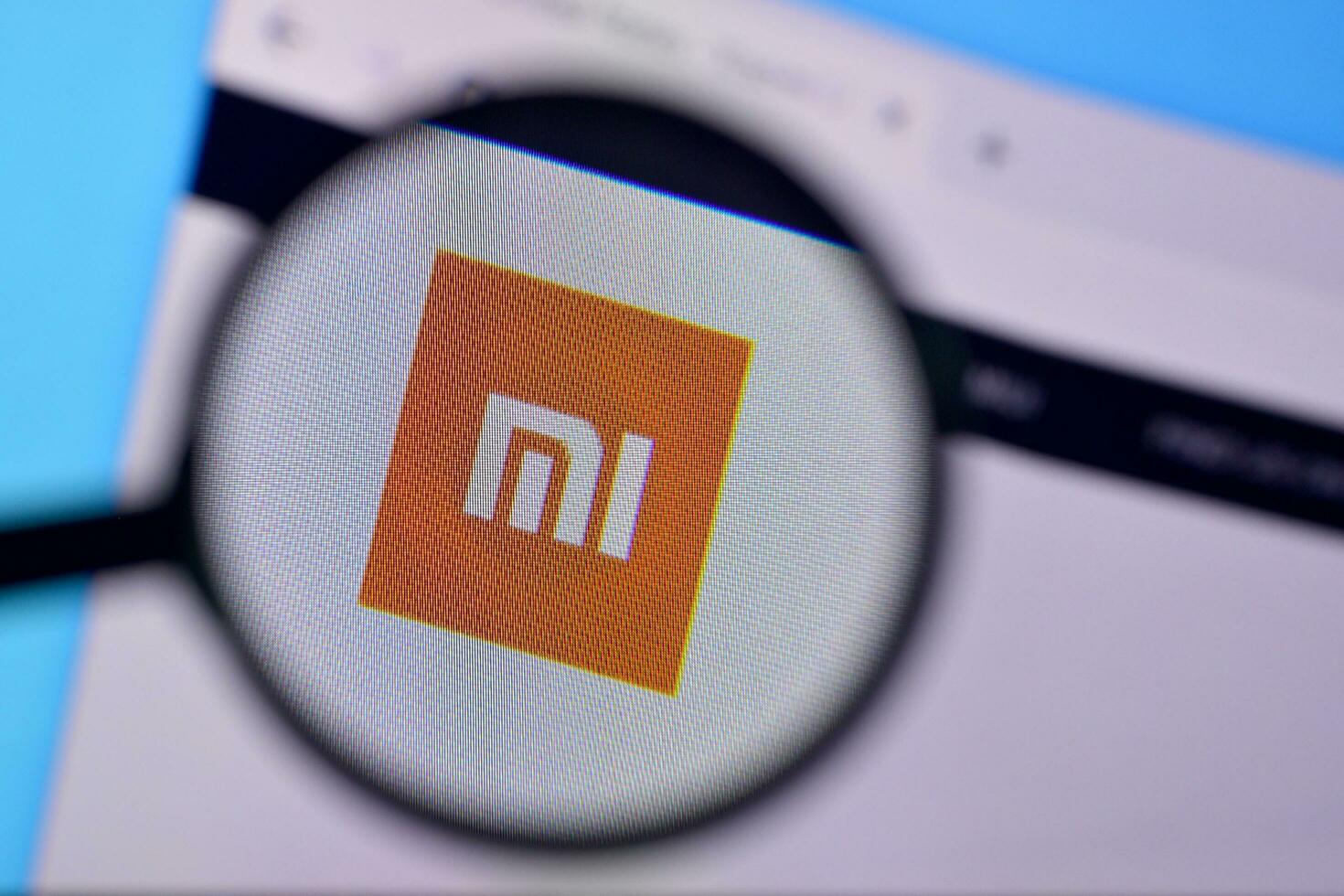 Homepage of xiaomi website on the display of PC, url - mi.com. photo