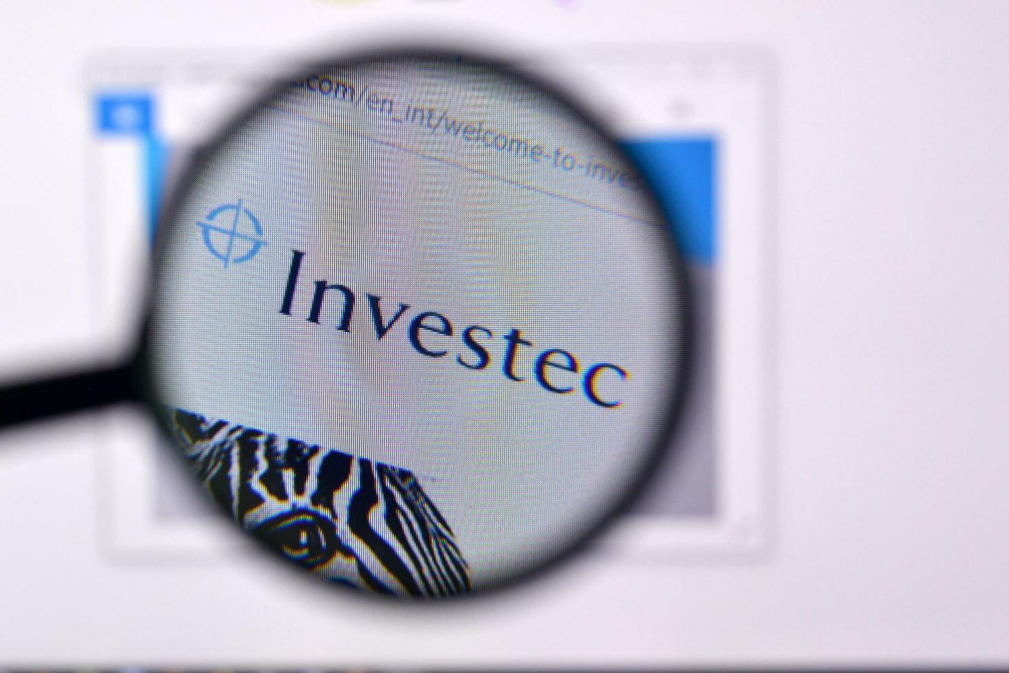 Homepage of investec website on the display of PC, url - investec.com. photo