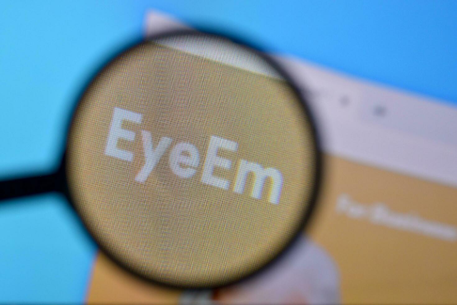 Homepage of eyeem website on the display of PC, url - eyeem.com. photo