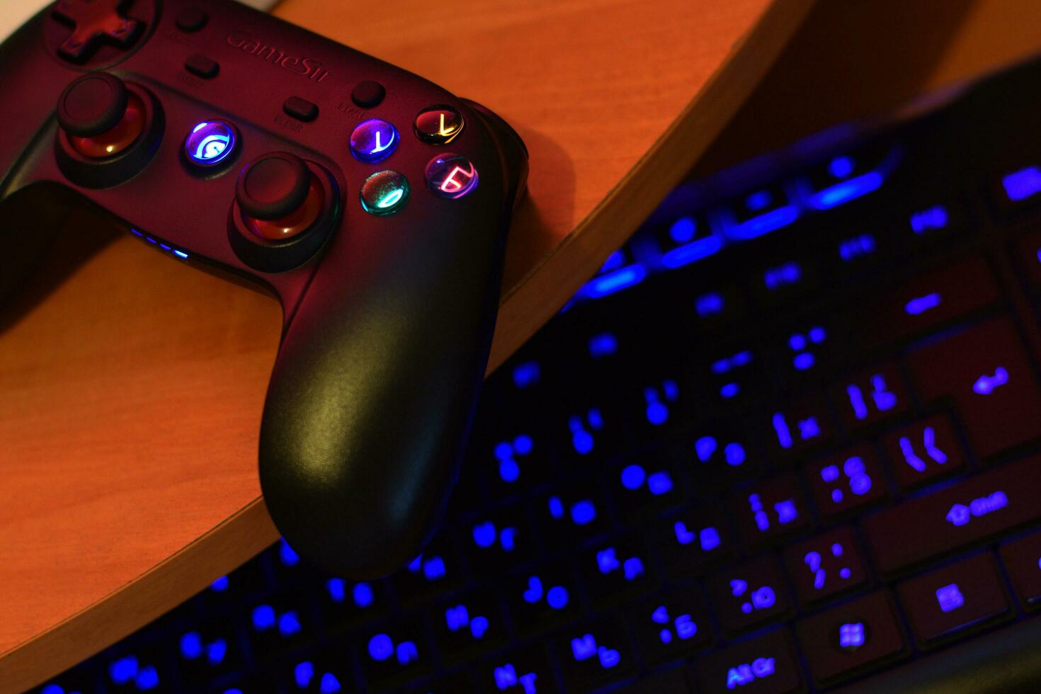 Gamesir g3s video game controller and a4tech keyboard on office table photo