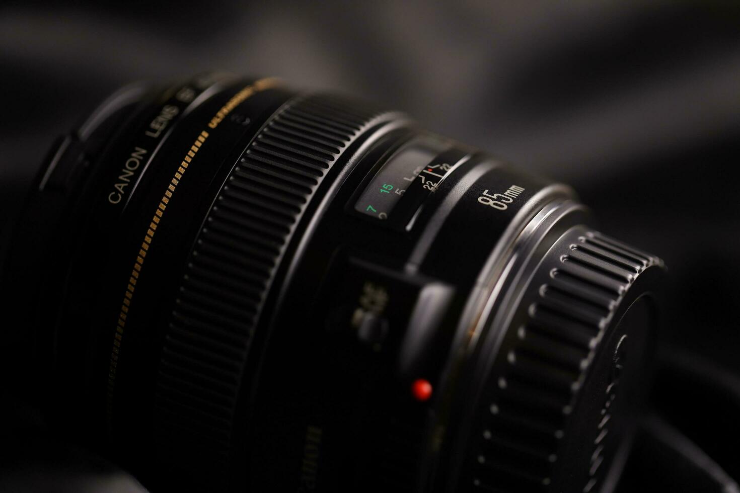 KHARKOV, UKRAINE - JANUARY 21, 2021 Canon EF 85mm 1.8 lens on fabric background. Detailed photo of Canon brand product