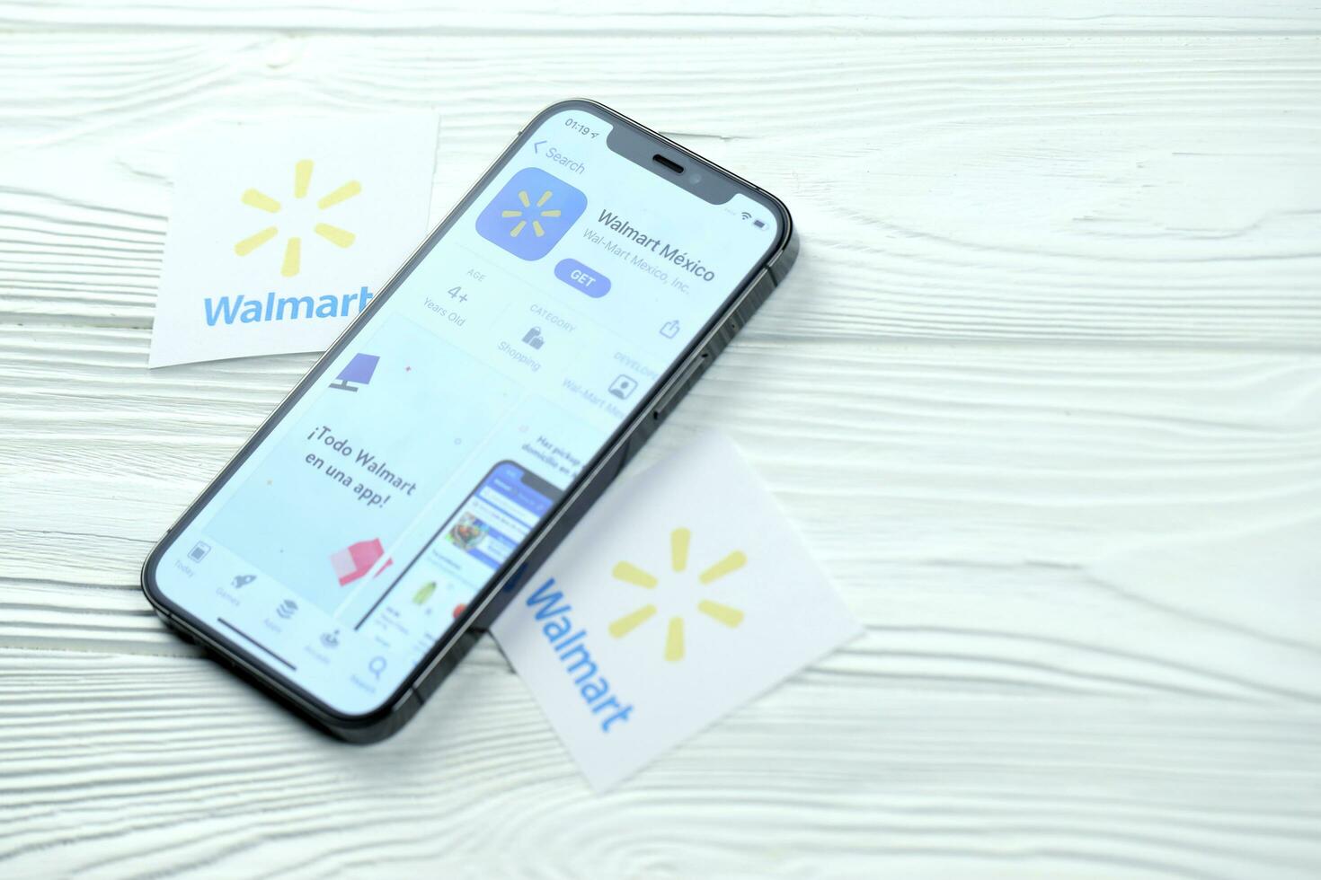 KHARKOV, UKRAINE - MARCH 5, 2021 Walmart icon and application from App store on iPhone 12 pro display screen on white table photo