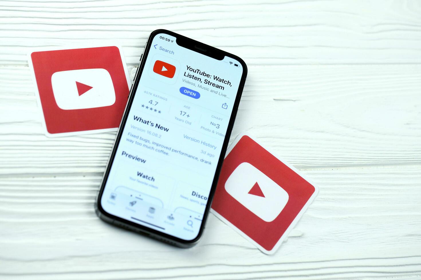 KHARKOV, UKRAINE - MARCH 5, 2021 Youtube icon and application from App store on iPhone 12 pro display screen on white table photo