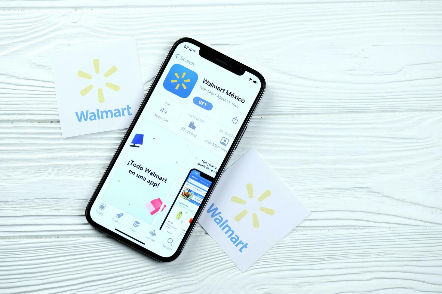 KHARKOV, UKRAINE - MARCH 5, 2021 Walmart icon and application from App store on iPhone 12 pro display screen on white table photo