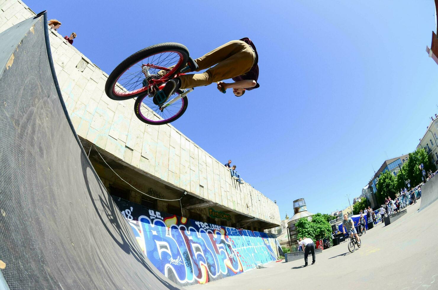 KHARKIV, UKRAINE - 27 MAY, 2018 Freestyle BMX riders in a skatepark during the annual festival of street cultures photo