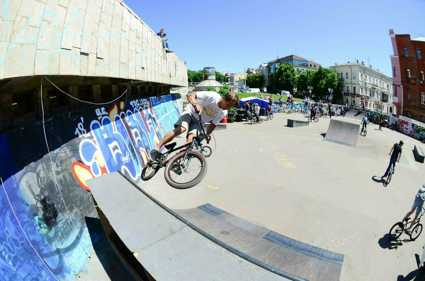 KHARKIV, UKRAINE - 27 MAY, 2018 Freestyle BMX riders in a skatepark during the annual festival of street cultures photo