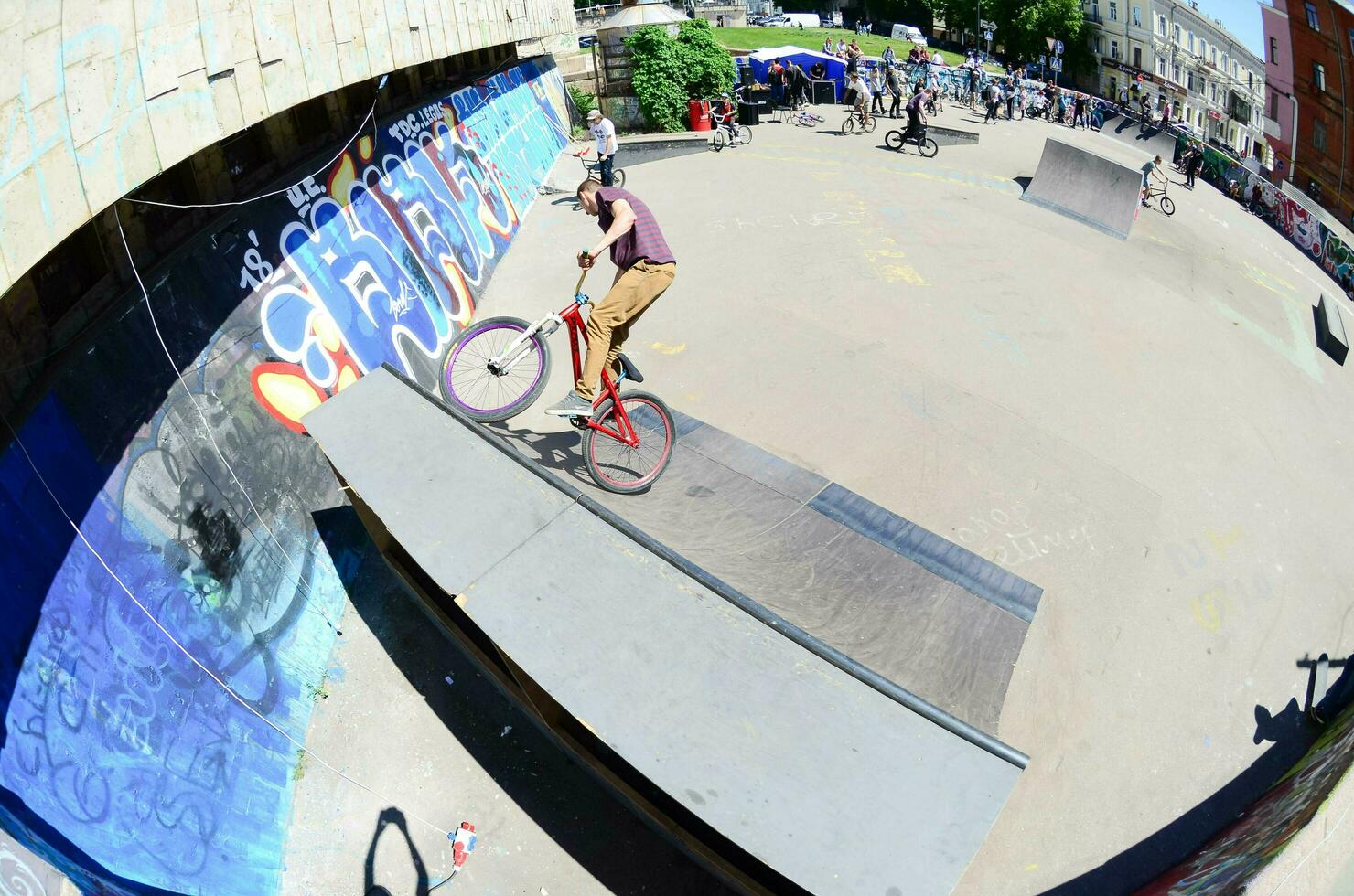 KHARKIV, UKRAINE - 27 MAY, 2018 Freestyle BMX riders in a skatepark during the annual festival of street cultures photo