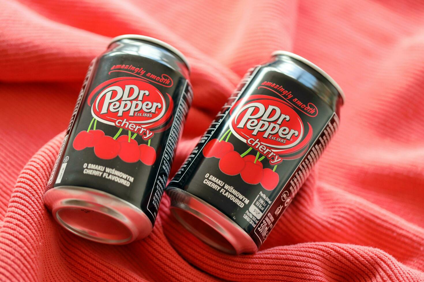 KYIV, UKRAINE - JULY 7, 2023 Dr Pepper cherry drink can on red background photo