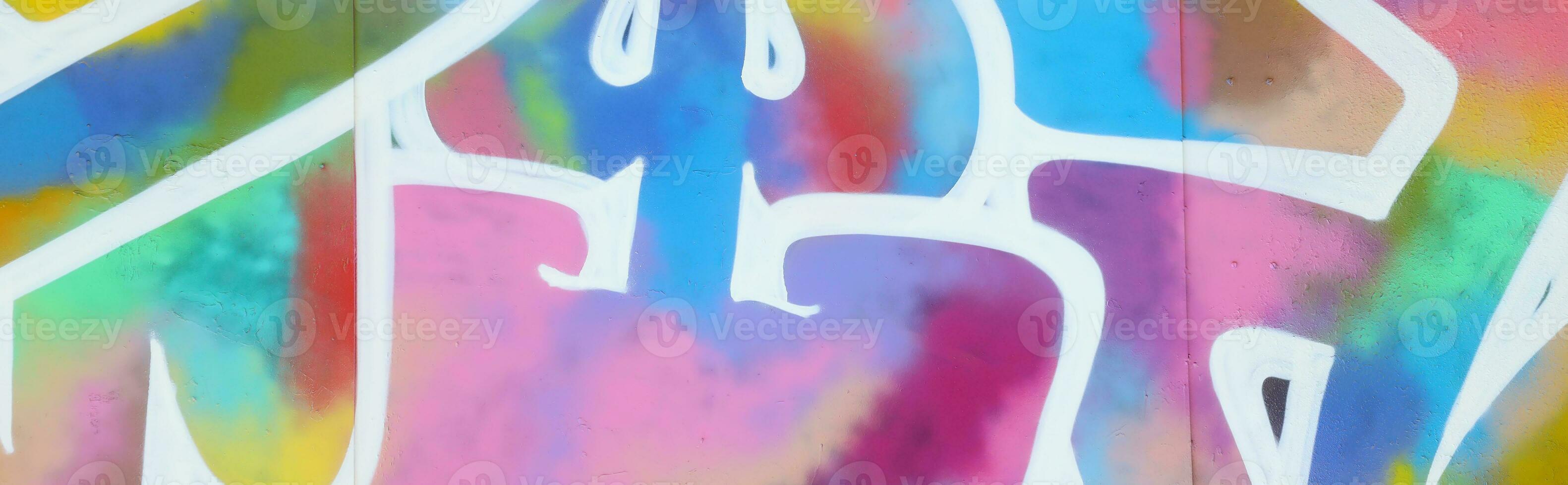 Colorful background of graffiti painting artwork with bright aerosol strips on metal wall photo