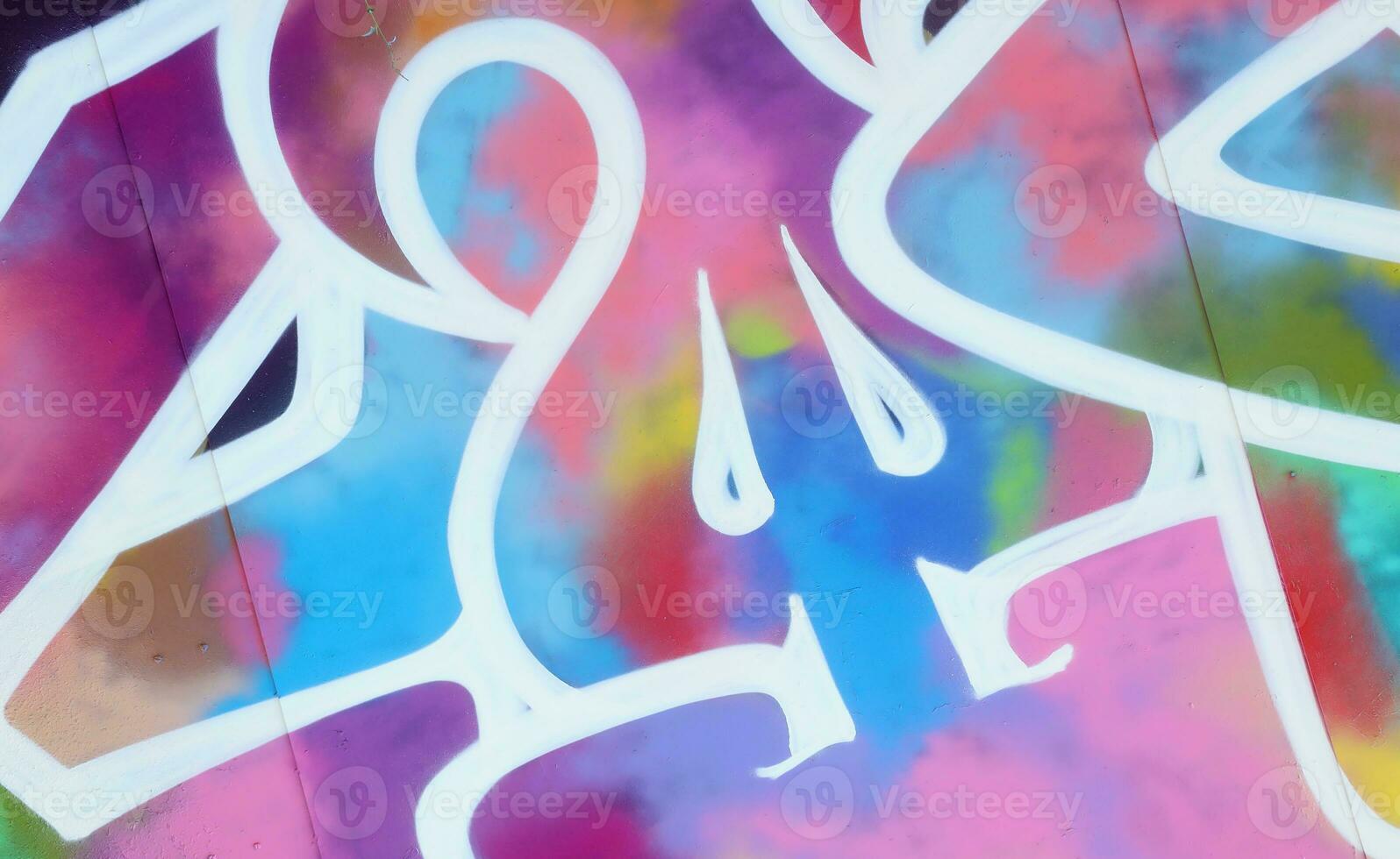 Colorful background of graffiti painting artwork with bright aerosol strips on metal wall photo