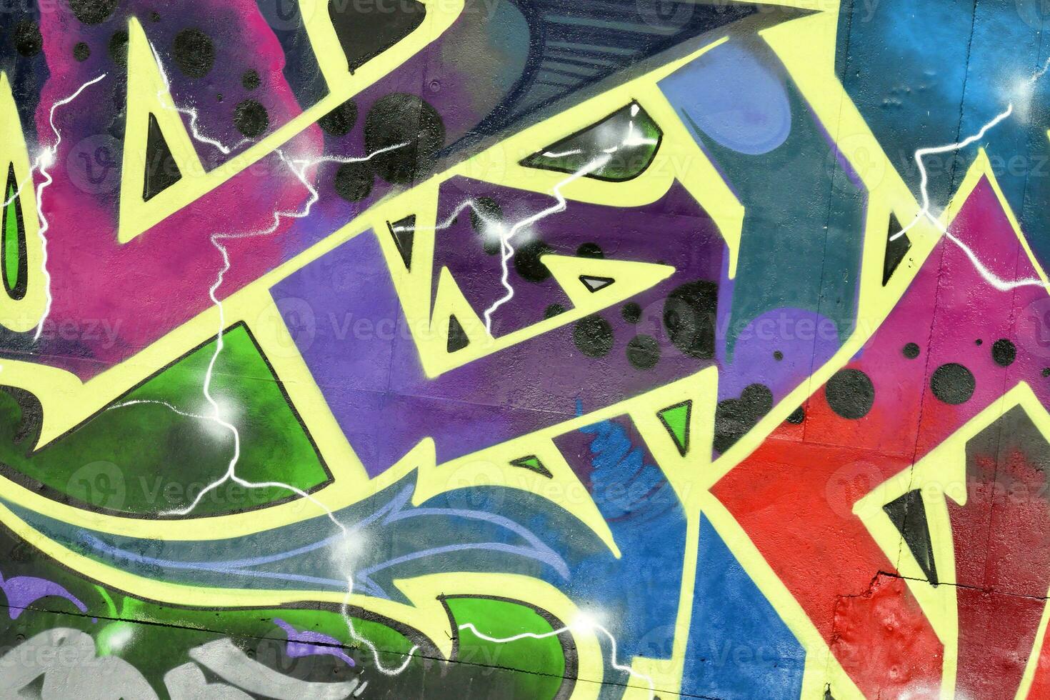 Colorful background of graffiti painting artwork with bright aerosol strips on metal wall photo