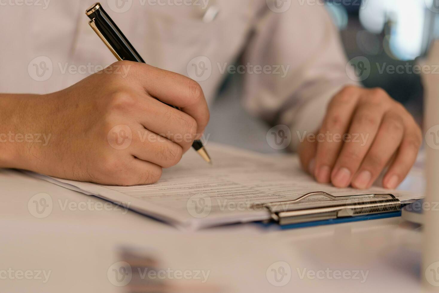 Business person Writing contract law and paper work for business and finance investments , write document, complete job application forms concept. photo
