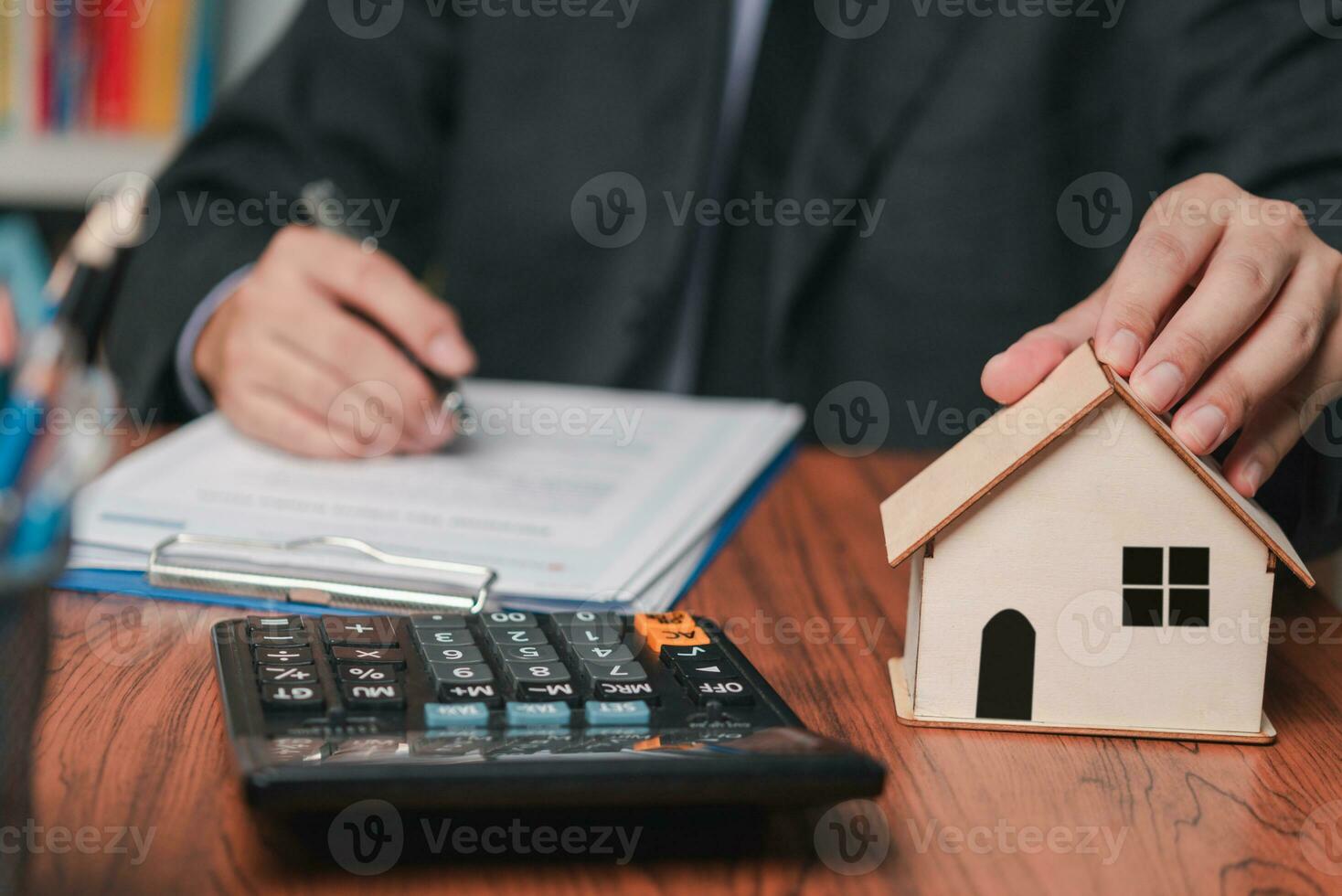 businessman working accountant document graph and chart on desk using calculator for calculate finance report in office. photo