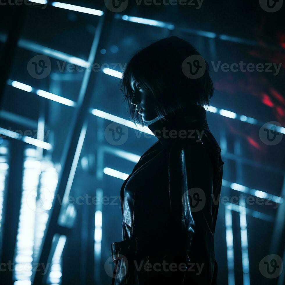 a woman in a black leather jacket standing in a dark room photo
