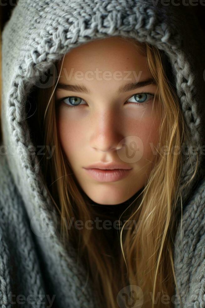 a beautiful young woman with blue eyes wearing a gray hoodie generative ai photo