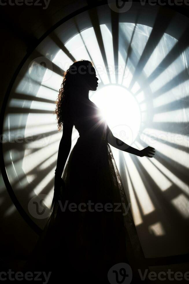 a silhouette of a woman in a dress standing in front of a circular window generative ai photo