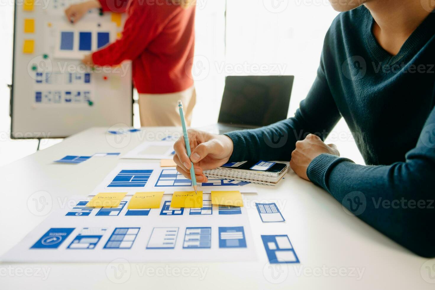 UX graphic designer planning application process development prototype wireframe for web smart phone. Creative digital development agency. photo