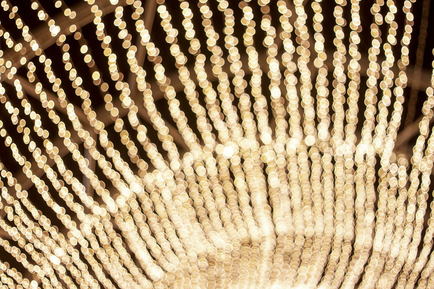 Abstract bokeh of light golden circle for background. photo
