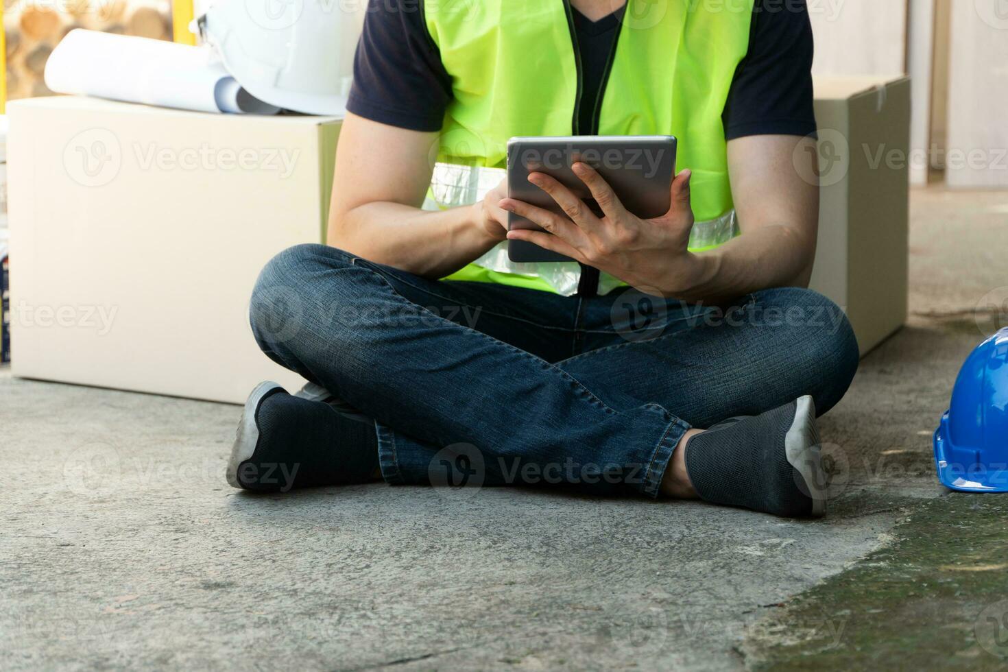 Asian homeowner holding tablet and try to understand a plan for house renovation and design for home construction building, Concept of professional architecture and home interior and handyman photo