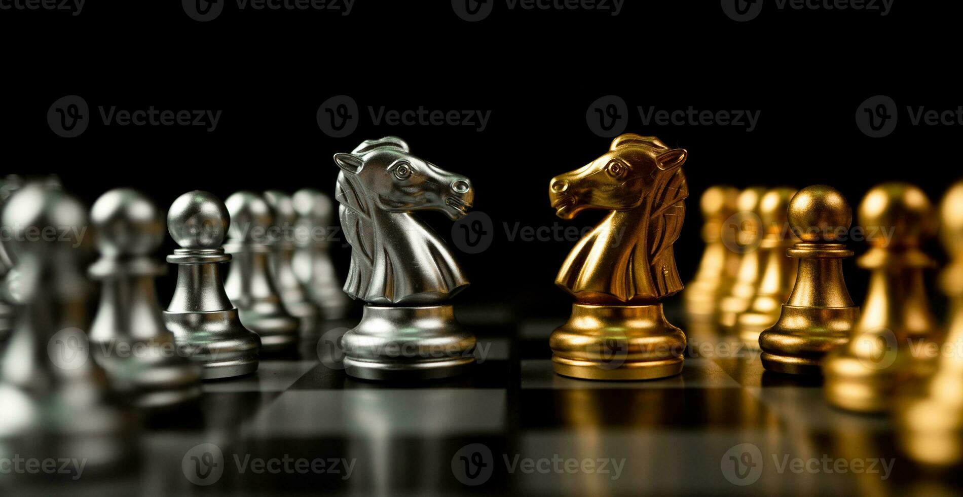Golden and silver horse chess pieces Invite face to face and There are chess pieces in the background. Concept of competing, leadership and business vision for a win in business games photo