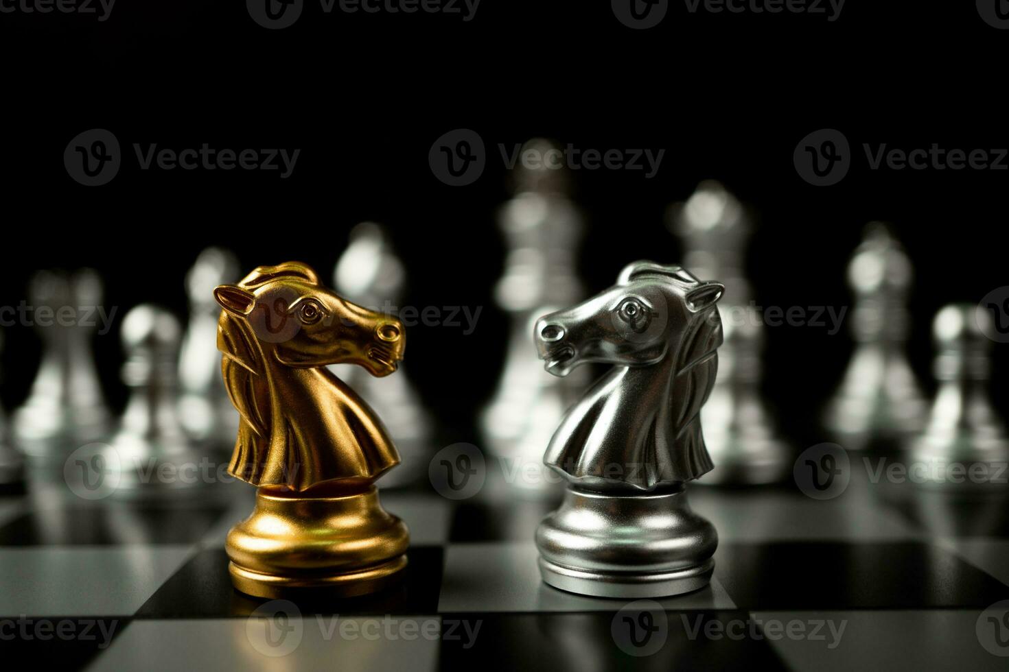 Golden and silver horse chess pieces Invite face to face and There are silver chess pieces in the background. Concept of competing, leadership and business vision for a win in business games photo