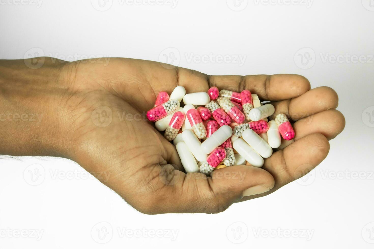 Handful of pills on white background, Health care and medical concept photo