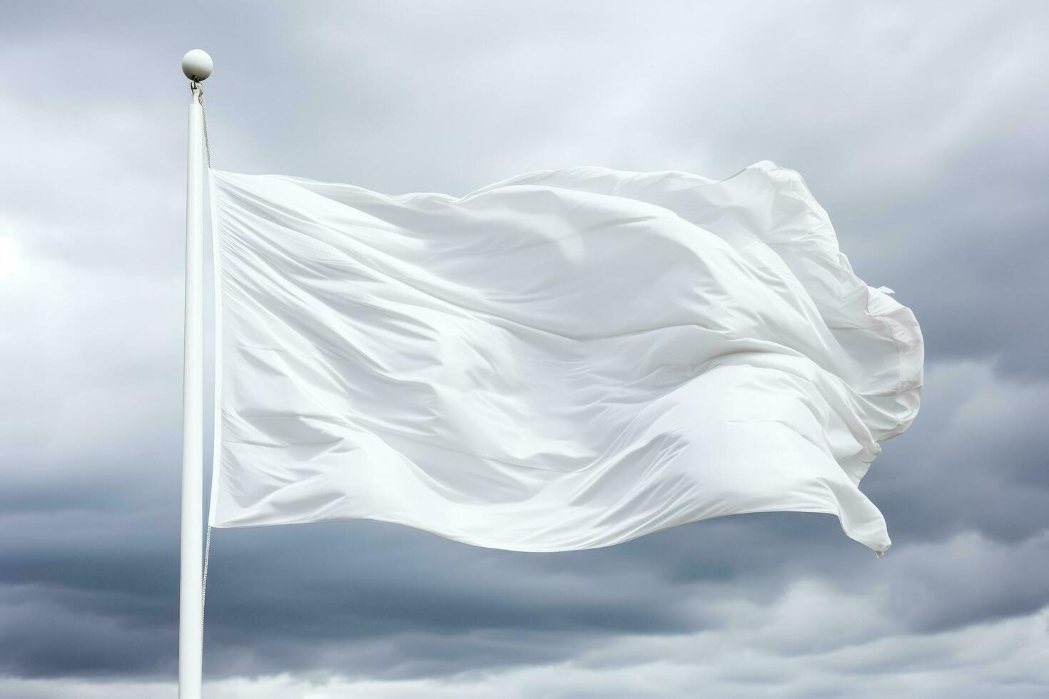 A fluttering white surrender flag against a stormy sky isolated on a white background photo