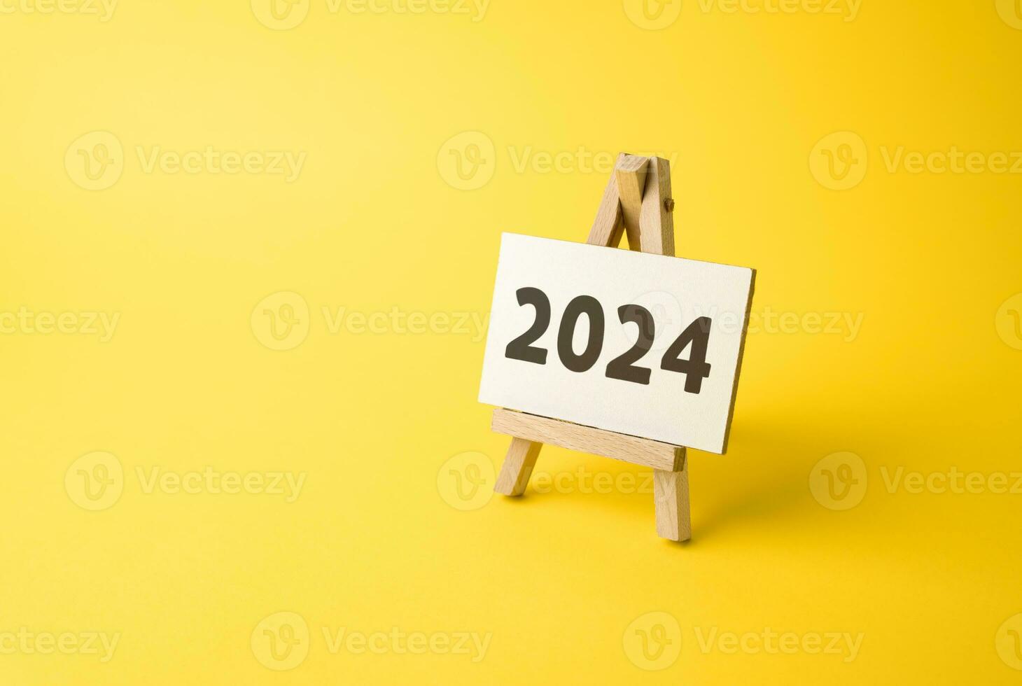 Stand with 2024 inscription. The beginning of a new year. Reflecting on past achievements and experiences, looking forward. Embracing new trends, making forecasts, setting plans for the upcoming year. photo