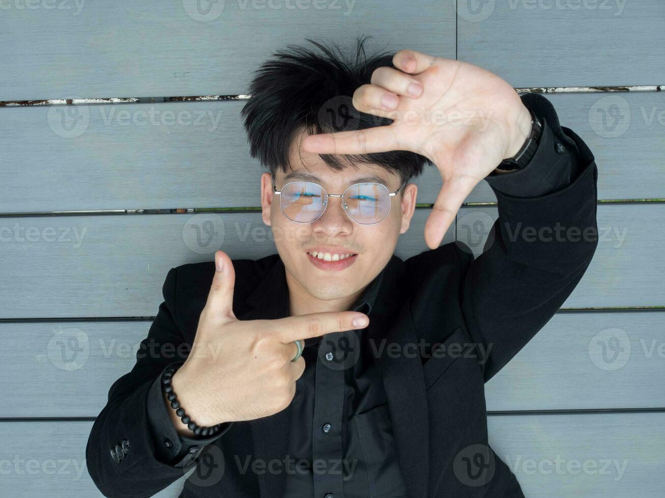 male man female woman businessman businesswoman boy girl person people human wooden background wear black suit glasses look at camera possing focus cheerful pointing finger business strategy vision photo