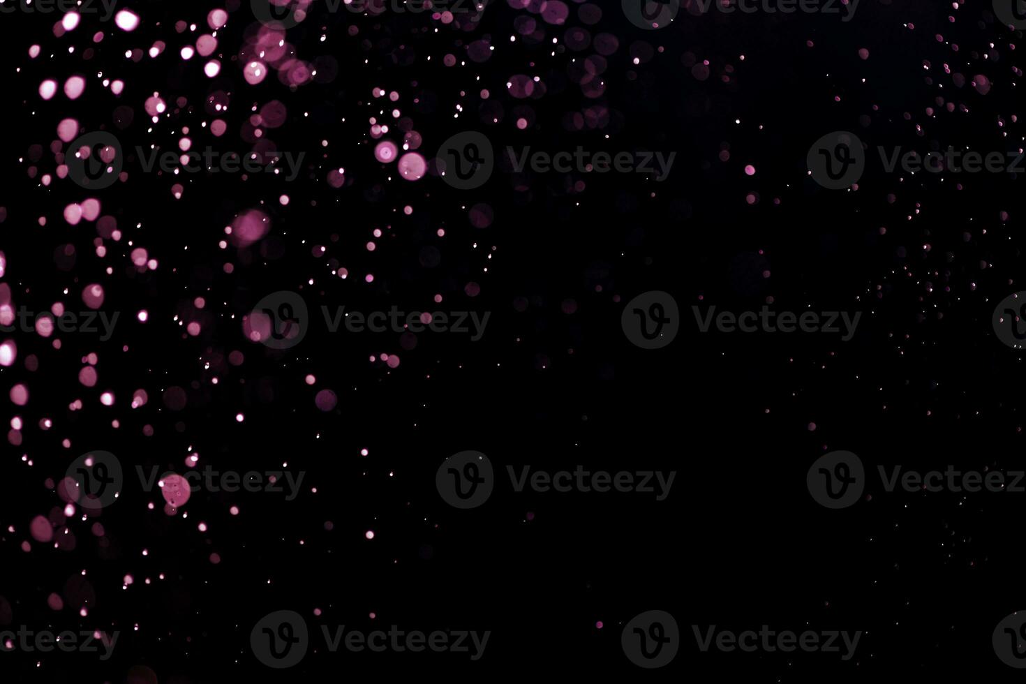 small drops of rain, snow on a black background. wind. Natural background photo