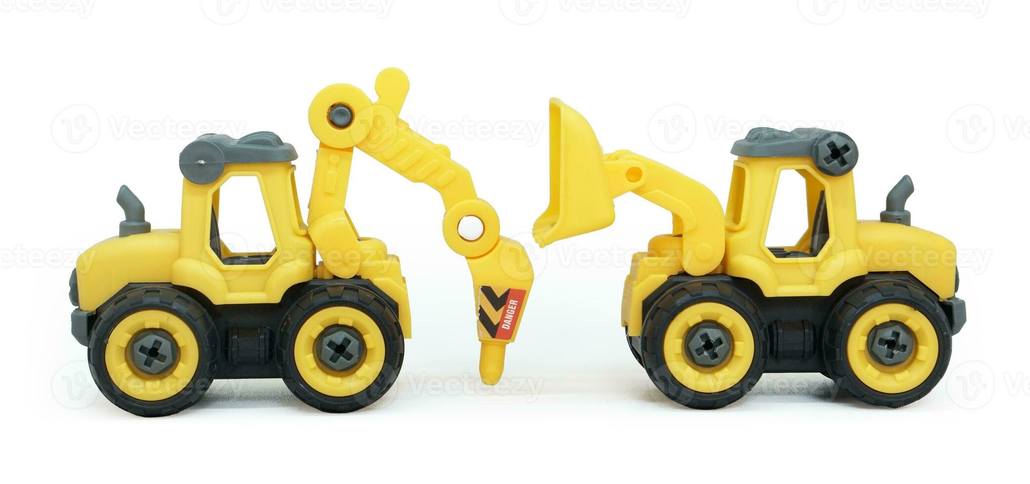 yellow plastic toy of tractor drill and bulldozer or loader isolated on white background. heavy construction vehicle. side view. photo